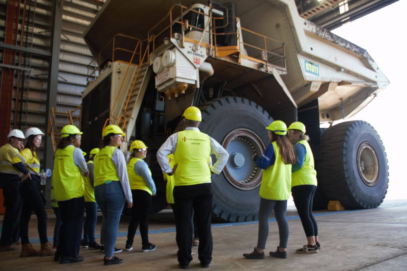 Image - students view haul truck on tour of Sino Iron