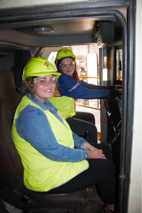 Image - students sit in cabin of haul truck on Sino Iron tour